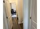 Hallway leading to an office with desk, plush chairs, and stylish decor creating a professional atmosphere at 606 Muster Field Ct., Conway, SC 29526