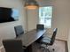 Modern meeting room with large table, comfortable chairs, and a wall-mounted TV for presentations at 606 Muster Field Ct., Conway, SC 29526
