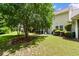 Lush backyard featuring a screened-in porch, mature trees, and well-maintained lawn at 6095 Catalina Dr. # 616, North Myrtle Beach, SC 29582