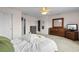 Spacious bedroom boasting ample natural light, a closet, and a dresser with a mirror at 6095 Catalina Dr. # 616, North Myrtle Beach, SC 29582