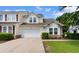 Charming two-story home features a white garage door, nicely landscaped yard, and light yellow siding at 6095 Catalina Dr. # 616, North Myrtle Beach, SC 29582