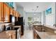 Kitchen features stainless steel appliances, oak cabinetry, and a breakfast nook at 6095 Catalina Dr. # 616, North Myrtle Beach, SC 29582
