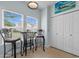 Cozy kitchen nook with bright windows, bar-height table and chairs, and tiled floor at 6095 Catalina Dr. # 616, North Myrtle Beach, SC 29582
