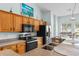 Kitchen features stainless steel appliances, oak cabinetry, and an eat-in bar at 6095 Catalina Dr. # 616, North Myrtle Beach, SC 29582