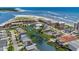 Aerial view of coastal neighborhood near beach, featuring waterway and beachfront condos at 6301 N Ocean Blvd. # 2B, North Myrtle Beach, SC 29582