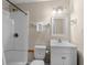 Bathroom featuring a shower and tub, vanity with sink, mirror, and toilet at 6301 N Ocean Blvd. # 2B, North Myrtle Beach, SC 29582