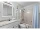 Bathroom with a white vanity and sink, a standard toilet, and a shower with a blue curtain at 6301 N Ocean Blvd. # 2B, North Myrtle Beach, SC 29582