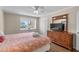 A bedroom featuring wood floors, a large window, and a wooden dresser at 6301 N Ocean Blvd. # 2B, North Myrtle Beach, SC 29582