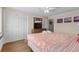 Comfortable bedroom featuring a seashell-patterned bedspread, ceiling fan, and closet at 6301 N Ocean Blvd. # 2B, North Myrtle Beach, SC 29582