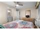 Cozy bedroom showcasing patterned bedding, wood-look flooring, and ample natural light at 6301 N Ocean Blvd. # 2B, North Myrtle Beach, SC 29582