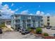 Three-story condo building featuring private balconies and ample parking space at 6301 N Ocean Blvd. # 2B, North Myrtle Beach, SC 29582