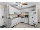 Bright kitchen features tiled backsplash and white cabinets at 6301 N Ocean Blvd. # 2B, North Myrtle Beach, SC 29582