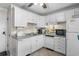 Bright kitchen features tiled backsplash and white appliances at 6301 N Ocean Blvd. # 2B, North Myrtle Beach, SC 29582