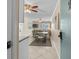 Comfortable living and dining area features tile floors, ceiling fans and access to a balcony at 6301 N Ocean Blvd. # 2B, North Myrtle Beach, SC 29582