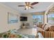 Living area includes tile floors, a flat screen TV, and access to a balcony overlooking the ocean at 6301 N Ocean Blvd. # 2B, North Myrtle Beach, SC 29582