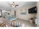 Well-lit living area featuring tile floors, seating and an attached kitchen with modern appliances at 6301 N Ocean Blvd. # 2B, North Myrtle Beach, SC 29582