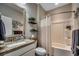 Bright bathroom featuring granite countertops, a shower-tub combination, and neutral-toned decor at 6430 Cascata Dr., Myrtle Beach, SC 29572