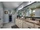 Beautiful bathroom with double vanity, granite countertop, and decorative mirror at 6430 Cascata Dr., Myrtle Beach, SC 29572