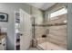 Modern bathroom with glass shower, neutral tiles, and convenient built-in bench at 6430 Cascata Dr., Myrtle Beach, SC 29572