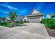 Beautiful home showcasing a wide driveway and a two-car garage at 6430 Cascata Dr., Myrtle Beach, SC 29572