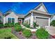 Charming home featuring manicured landscaping, gray siding, and a welcoming front entrance at 6430 Cascata Dr., Myrtle Beach, SC 29572
