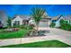 Well-maintained home featuring vibrant landscaping, a tree, and a welcoming front entrance at 6430 Cascata Dr., Myrtle Beach, SC 29572