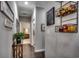 Hallway featuring hardwood floors, neutral-colored walls, and decorative fruit baskets at 6430 Cascata Dr., Myrtle Beach, SC 29572