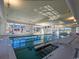 Bright indoor pool with large windows and clear blue water at 6430 Cascata Dr., Myrtle Beach, SC 29572