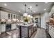 Expansive kitchen with large island, bar stool seating, and stainless steel appliances at 6430 Cascata Dr., Myrtle Beach, SC 29572
