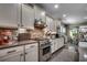 Well-equipped kitchen featuring stainless steel appliances, counter, and an adjacent dining area at 6430 Cascata Dr., Myrtle Beach, SC 29572