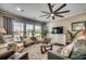 Cozy living room featuring plush seating, large windows, and decorative accents at 6430 Cascata Dr., Myrtle Beach, SC 29572