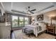 Serene main bedroom with tray ceiling, large windows, and elegant furnishings at 6430 Cascata Dr., Myrtle Beach, SC 29572