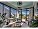 Bright sunroom with panoramic views, comfortable seating, and seamless outdoor access at 6430 Cascata Dr., Myrtle Beach, SC 29572