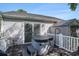 Backyard wooden deck featuring a hot tub and seating area perfect for relaxing outdoors at 6570 Pebble Beach Crescent, Myrtle Beach, SC 29588