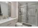 Modern bathroom featuring tiled shower and marble vanity at 6570 Pebble Beach Crescent, Myrtle Beach, SC 29588