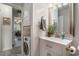 Stylish bathroom with laundry closet and modern fixtures at 6570 Pebble Beach Crescent, Myrtle Beach, SC 29588
