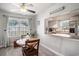 Cozy dining area with wood table, ceiling fan, and view into kitchen at 6570 Pebble Beach Crescent, Myrtle Beach, SC 29588