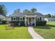 Charming single story home featuring a well manicured front yard and cozy entrance at 6570 Pebble Beach Crescent, Myrtle Beach, SC 29588