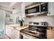 Kitchen featuring stainless steel appliances and ample counter space at 6570 Pebble Beach Crescent, Myrtle Beach, SC 29588