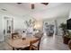 Open living space with comfortable seating, dining area, and access to the outdoor space at 6570 Pebble Beach Crescent, Myrtle Beach, SC 29588