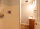 Bathroom features a shower stall and compact wood-toned vanity at 6936 Woodhaven Dr., Myrtle Beach, SC 29588