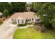 Aerial view of a single-story home with a well-maintained lawn and mature trees at 6936 Woodhaven Dr., Myrtle Beach, SC 29588