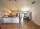 Open-concept kitchen featuring a breakfast bar, stainless appliances, and a dining area at 6936 Woodhaven Dr., Myrtle Beach, SC 29588