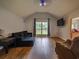 Comfortable living room with hardwood floors and natural light from the window at 6936 Woodhaven Dr., Myrtle Beach, SC 29588