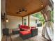 Inviting covered patio with comfortable seating and stylish ceiling fans at 6936 Woodhaven Dr., Myrtle Beach, SC 29588