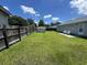 Fenced in backyard with green grass, patio and small metal shed at 706 Jamie Ln., Conway, SC 29526