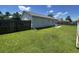 Fenced in backyard with green grass, patio, light gray siding and a drain pipe at 706 Jamie Ln., Conway, SC 29526