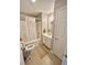 Neutral bathroom featuring a shower-tub combo, white vanity, and a neutral tiled floor at 706 Jamie Ln., Conway, SC 29526