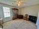 Bedroom with a ceiling fan, natural light, and neutral walls with carpet floors at 706 Jamie Ln., Conway, SC 29526