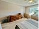 Bedroom with neutral walls and carpet, a large dresser, and natural light from the window at 706 Jamie Ln., Conway, SC 29526